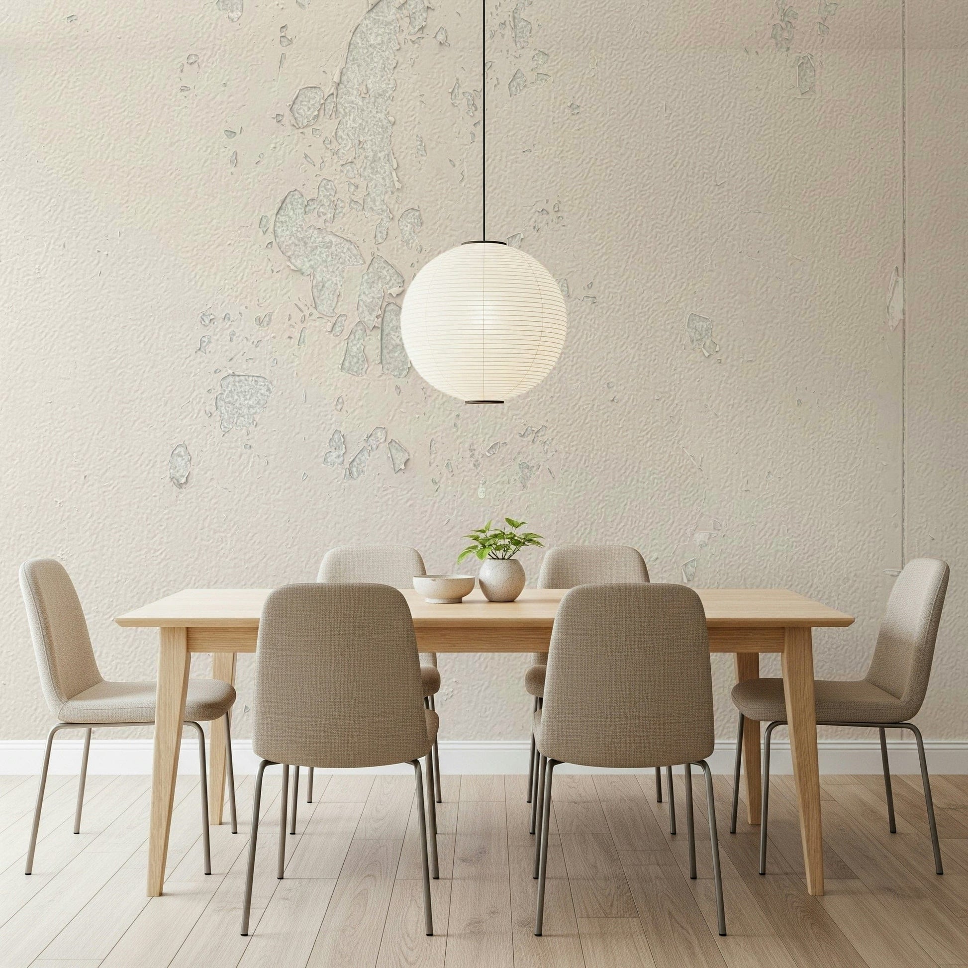 Subtle Texture wallpaper mural in cream plaster behind a wood dining table and paper globe pendant