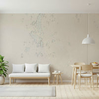 Subtle Texture wallpaper mural in cream plaster behind a white bench sofa and wood dining set