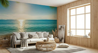 Calm beach mural wallpaper behind sofa, neutral colour tones, relaxed home styling
