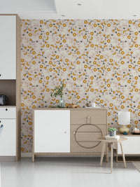Whimsical mustard flowers and simple leaves forming a charming botanical wallpaper design.