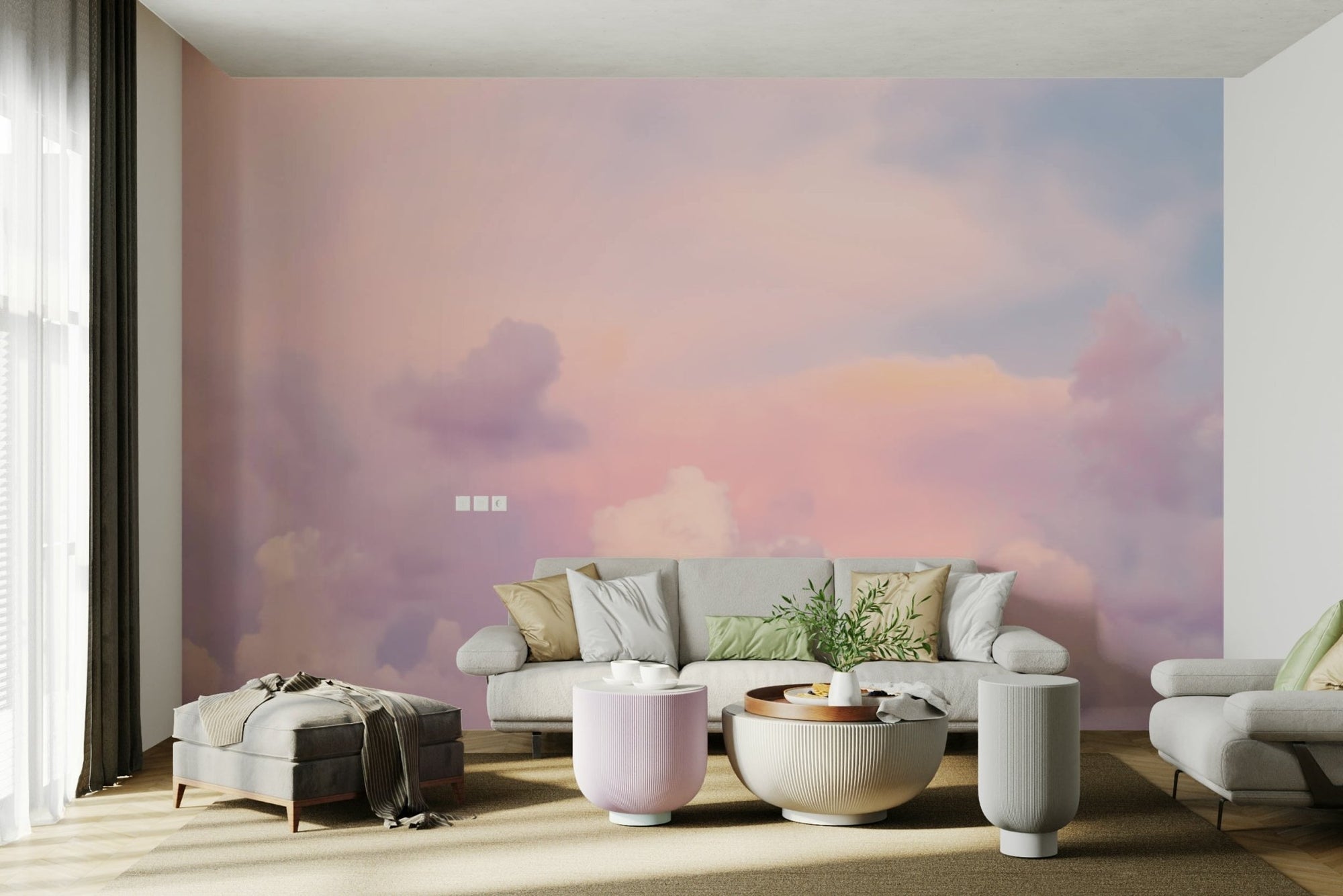 Sunset Clouds in Pastel Colors wallpaper mural in soft pink and lilac behind a grey sofa in a bright living room