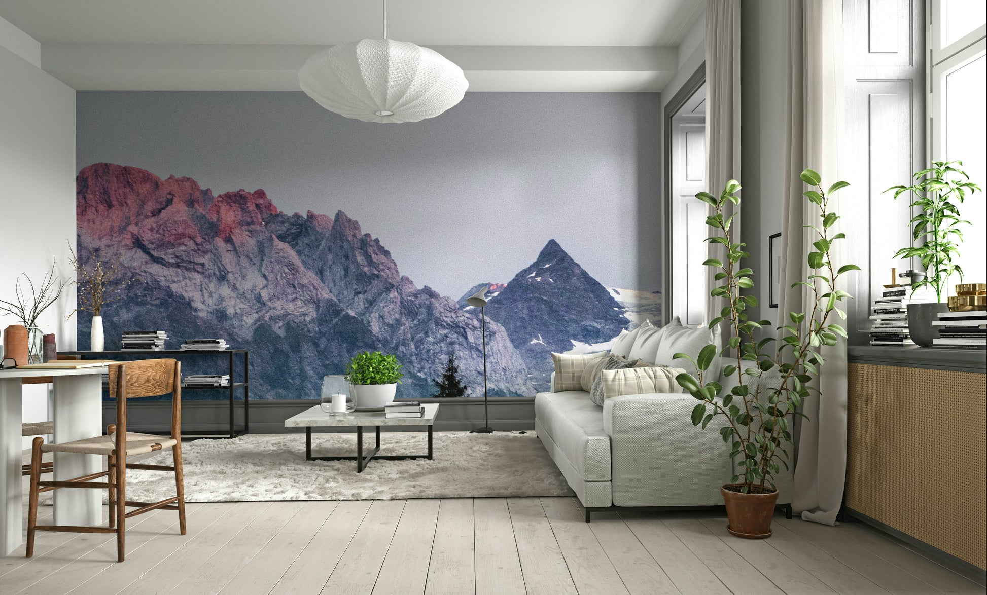 Sunset Mountain Vista wall mural behind a grey sofa and paper pendant lamp in a bright living room
