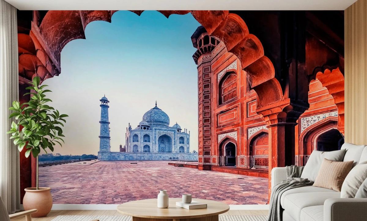 Taj Mahal Architecture wallpaper mural framing the white marble dome through a red archway behind a white sofa in a living room