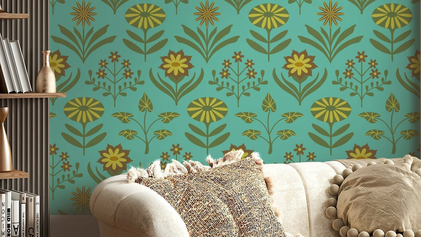Stylized floral and leaf patterns in olive green, brown, and turquoise on a wall.

