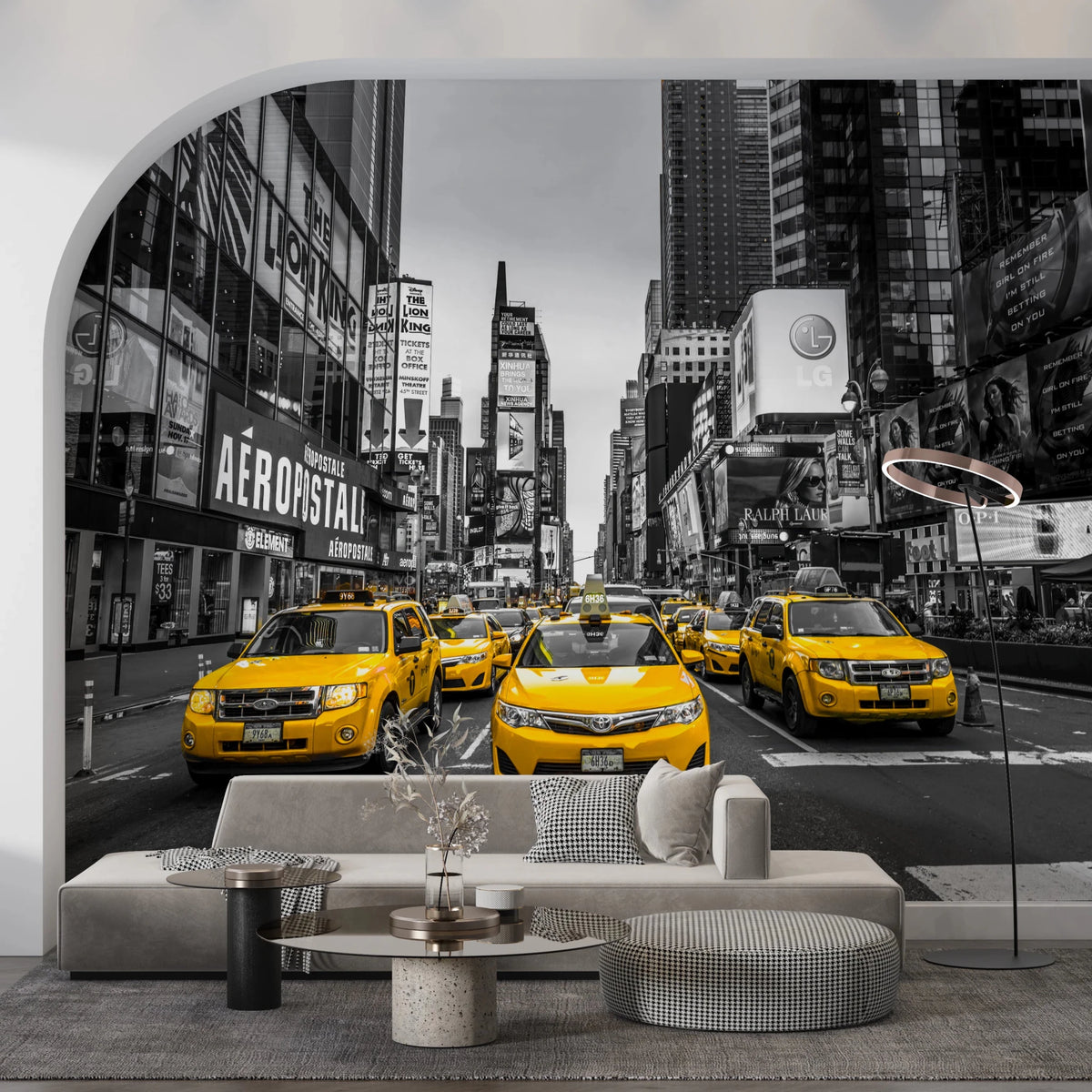 Taxi Rush Hour wallpaper mural of yellow cabs in black-and-white Times Square behind a beige sofa in a living room