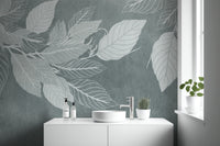 Elegant Teal Botanical Leaf wallpaper mural with pale leaves behind a white vanity and round sink by a bathroom window