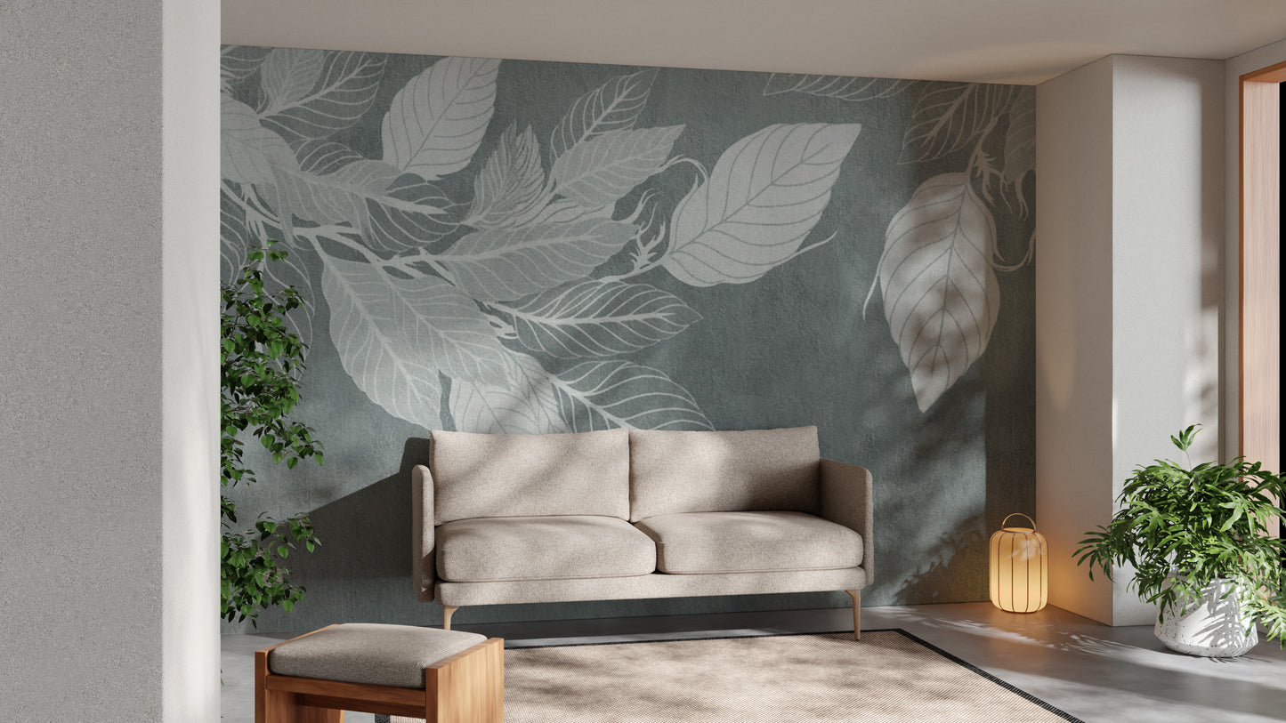 Elegant Teal Botanical Leaf wallpaper mural with white leaves behind a beige two-seater sofa and lantern in a living room