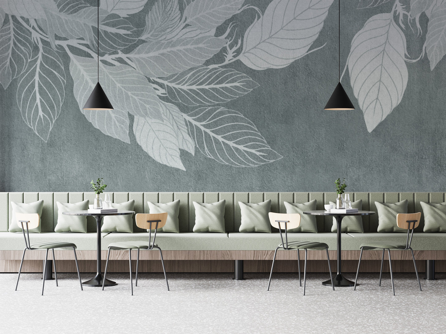 Elegant Teal Botanical Leaf wallpaper mural with pale leaf silhouettes behind a sage banquette and bistro tables in a cafe