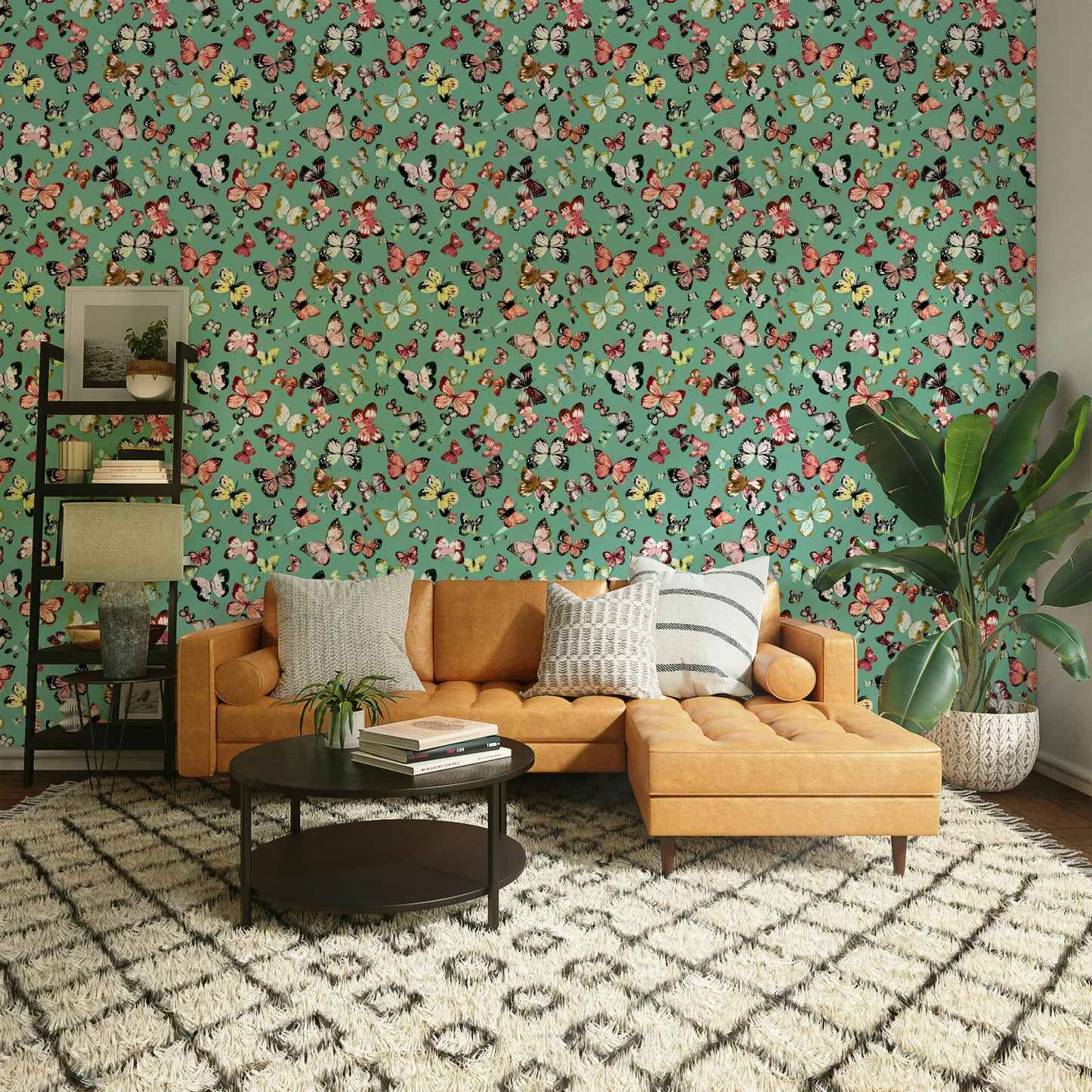 Flying Butterflies Colorful Teal Coral wallpaper behind a tan leather sectional sofa and palm in a living room