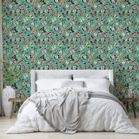 Flying Butterflies Colorful Teal Coral wallpaper behind a white upholstered headboard and grey throw in a bedroom