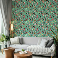 Flying Butterflies Colorful Teal Coral wallpaper behind a light grey sofa with throw and plants in a living room