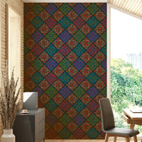 A damask-style print with jewel tones on dark teal.


