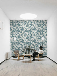 The mural is created for an entire wall, providing a lively backdrop.
