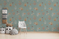 Teal Oceanic Wonders wall mural behind a white cat chair, panda bins and a gray whale plush