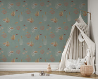 Teal Oceanic Wonders wall mural beside a cream canopy bed and white swan plush in a kids room