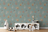 Teal Oceanic Wonders wall mural behind a white toy cabinet with a guitar and toy drum