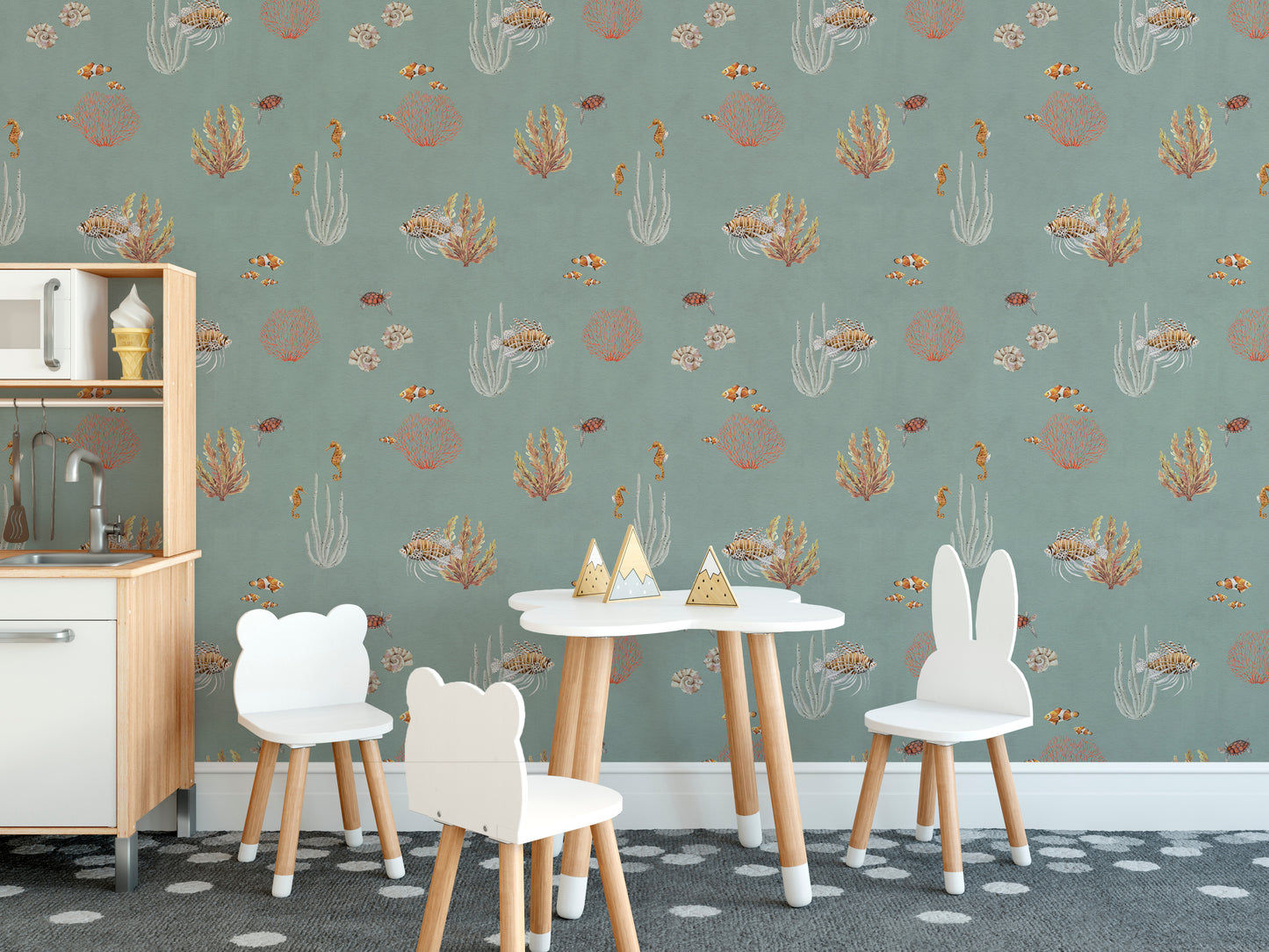 Teal Oceanic Wonders wall mural by a white play kitchen and bear chairs on a dotted rug