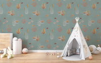 Teal Oceanic Wonders wall mural with lionfish and coral beside a white teepee in a kids room