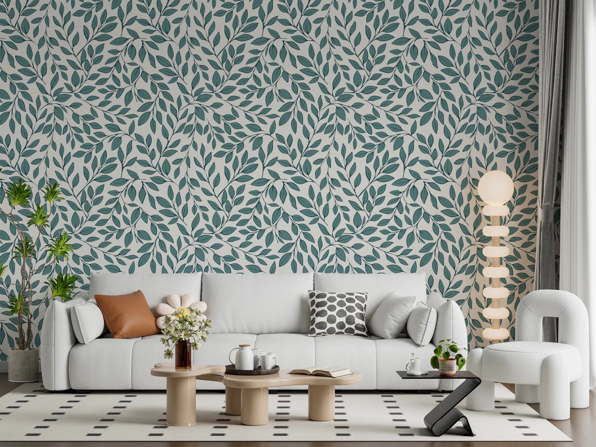Teal Vines wallpaper of teal leaves on cream behind a white sofa and orb floor lamp in a modern living room