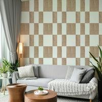 Textured Taupe & White checkerboard wallpaper mural behind a grey sofa with grey pillows in a living room