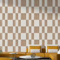 Textured Taupe & White checkerboard wallpaper mural behind a mustard yellow sectional sofa in a living room