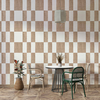 Textured Taupe & White checkerboard wallpaper mural in a dining nook with a white table and rattan chairs