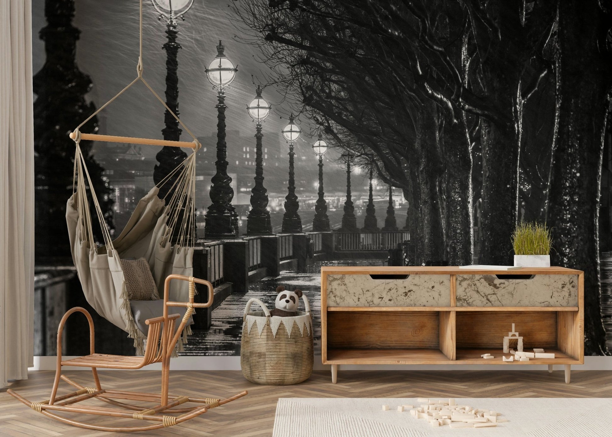 A close-up view of a glowing lamppost and a dark tree trunk.

