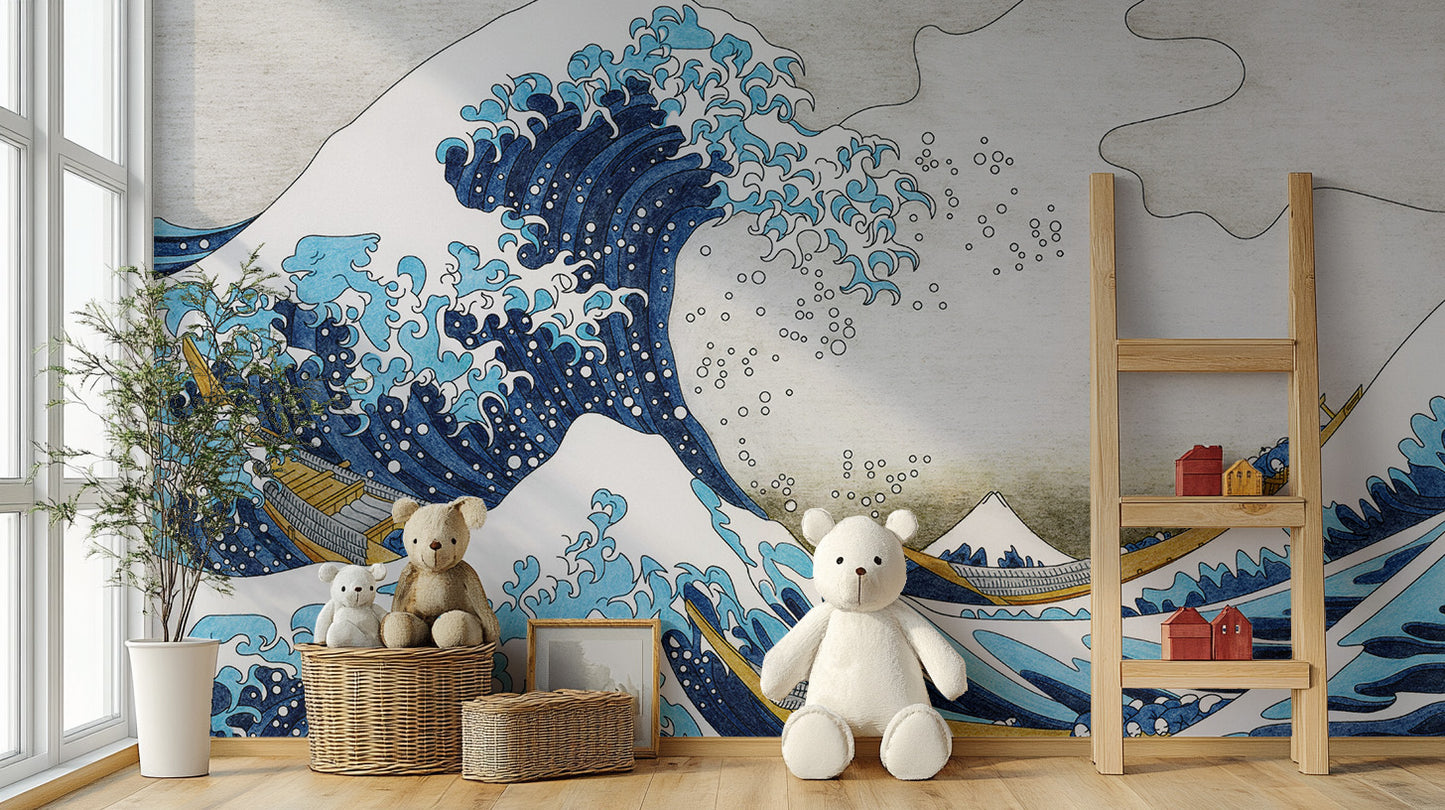 The Great Wave Kanagawa wallpaper mural in blue and beige behind teddy bears, woven baskets and a ladder shelf