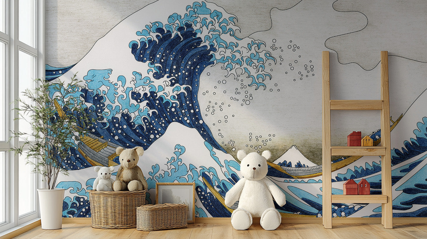 The Great Wave Kanagawa wallpaper mural in blue and beige behind teddy bears, woven baskets and a ladder shelf