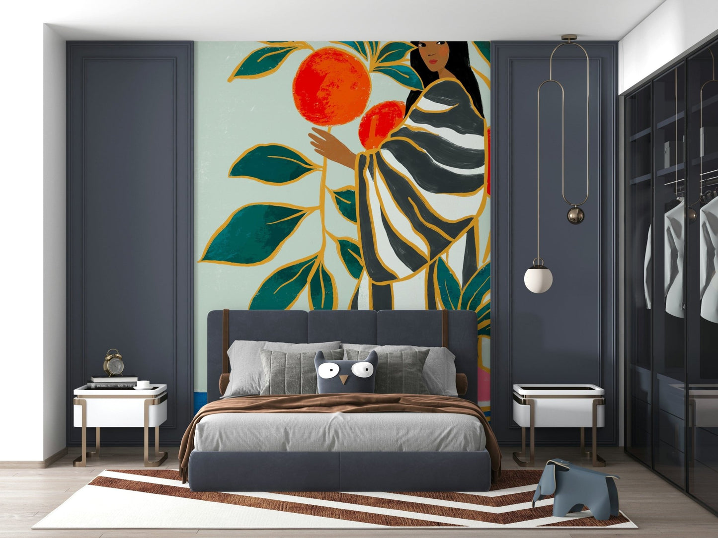 The Keeper of Oranges wallpaper mural of a woman and oranges behind a gray bed framed by navy paneled walls