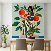 The Keeper of Oranges wallpaper mural of a woman by an orange tree behind a wood dining table with taupe chairs