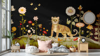 Tibetan Flower Tiger wallpaper mural showing a tiger amid flowers on black in a cozy kids nook with pink cushion and round mirror