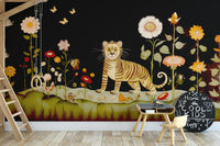 Tibetan Flower Tiger wallpaper mural with a folk-art tiger among flowers on black in a kids playroom with chalkboard and swing
