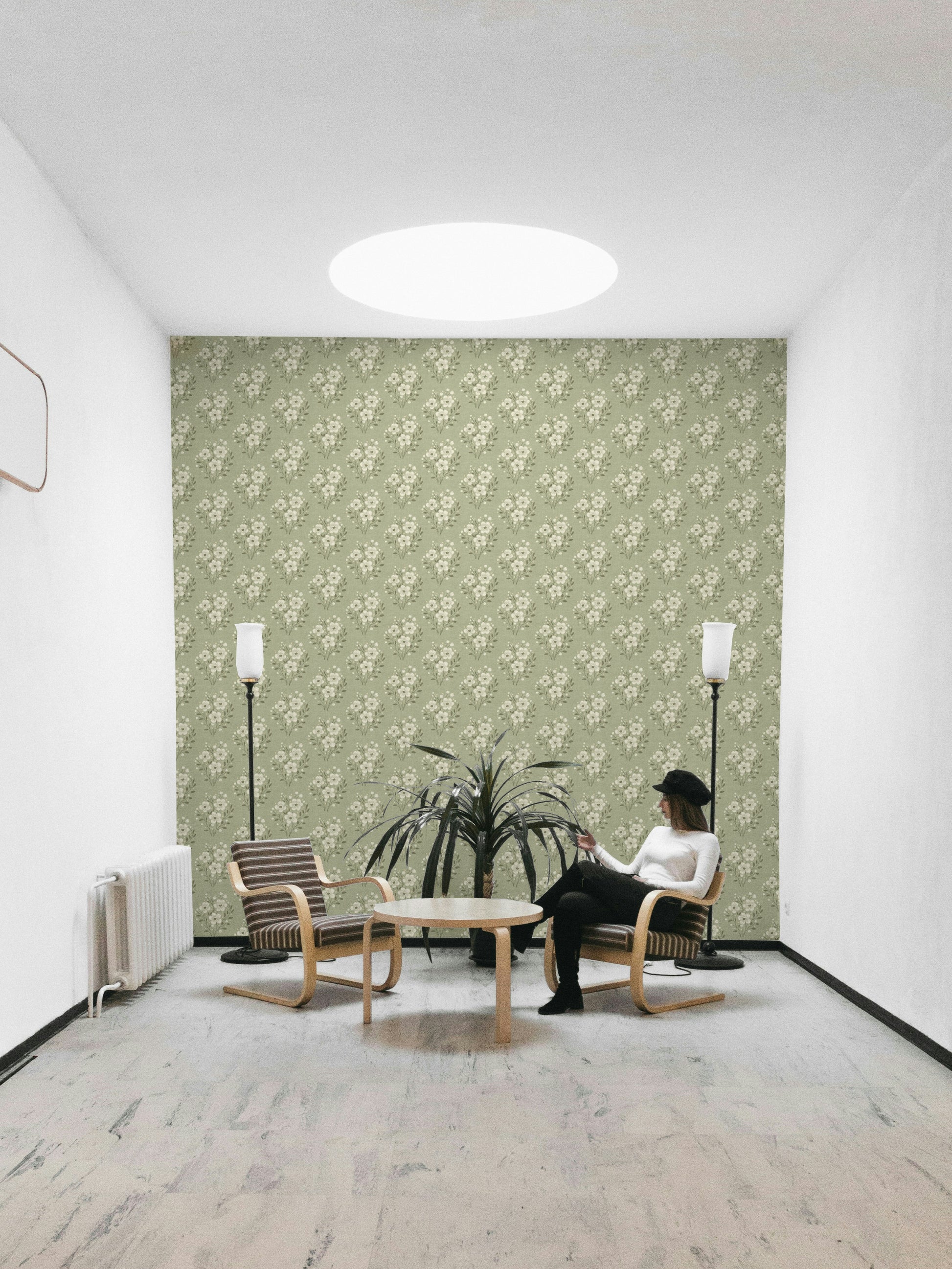 Botanical bouquet print on soft green wallpaper


