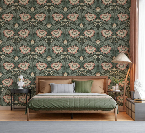 Timeless Garden Forest Green wallpaper with sage and blush damask florals behind a cane bed with green bedding in a bedroom