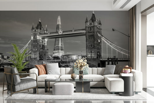 Tower Bridge and the Shard wallpaper mural over a cream sectional and black leather chair in a living room