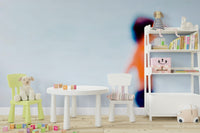 A peaceful Mediterranean beach mural on decorative wallpaper.

