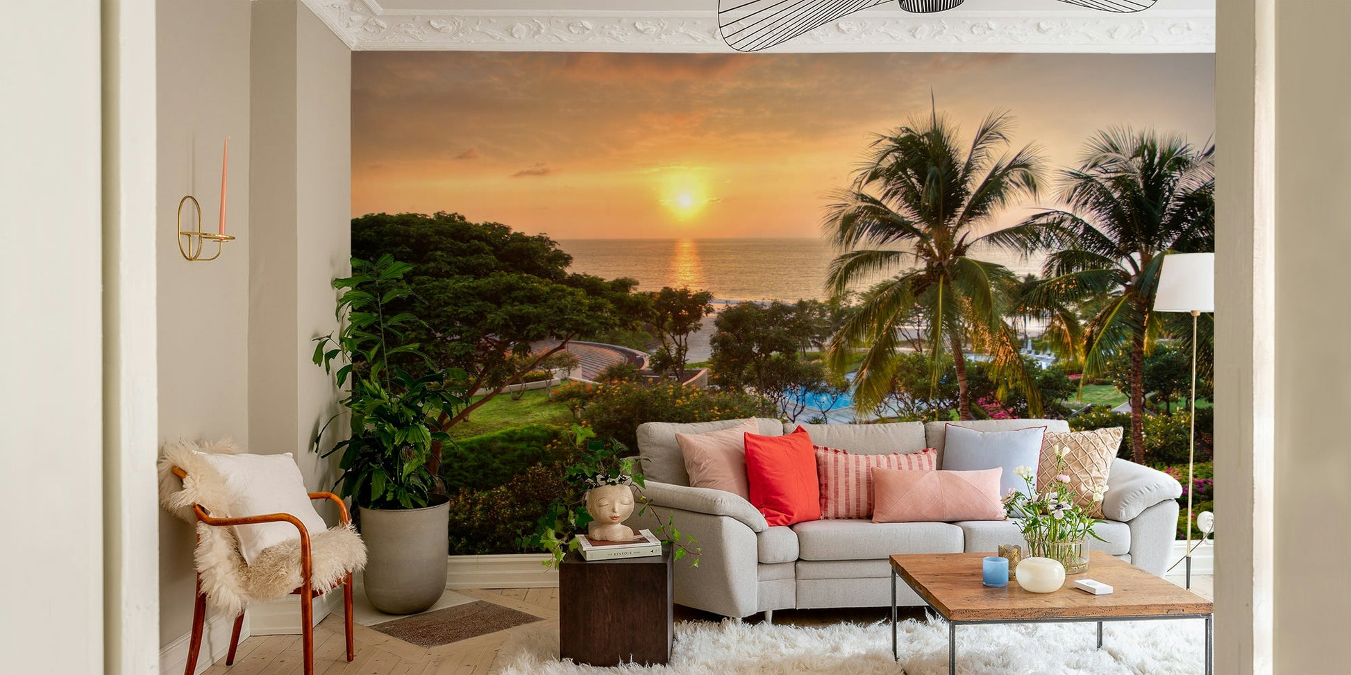 Tranquil Hawaii Island Sunset wallpaper mural showing the ocean sunset behind a grey sofa with coral pillows