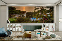 Tranquil Hawaii Island Sunset wallpaper mural with sea and palm trees above a blue sofa and arched cabinets
