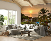 Tranquil Hawaii Island Sunset wallpaper mural showing an orange ocean sunset behind a grey sectional sofa