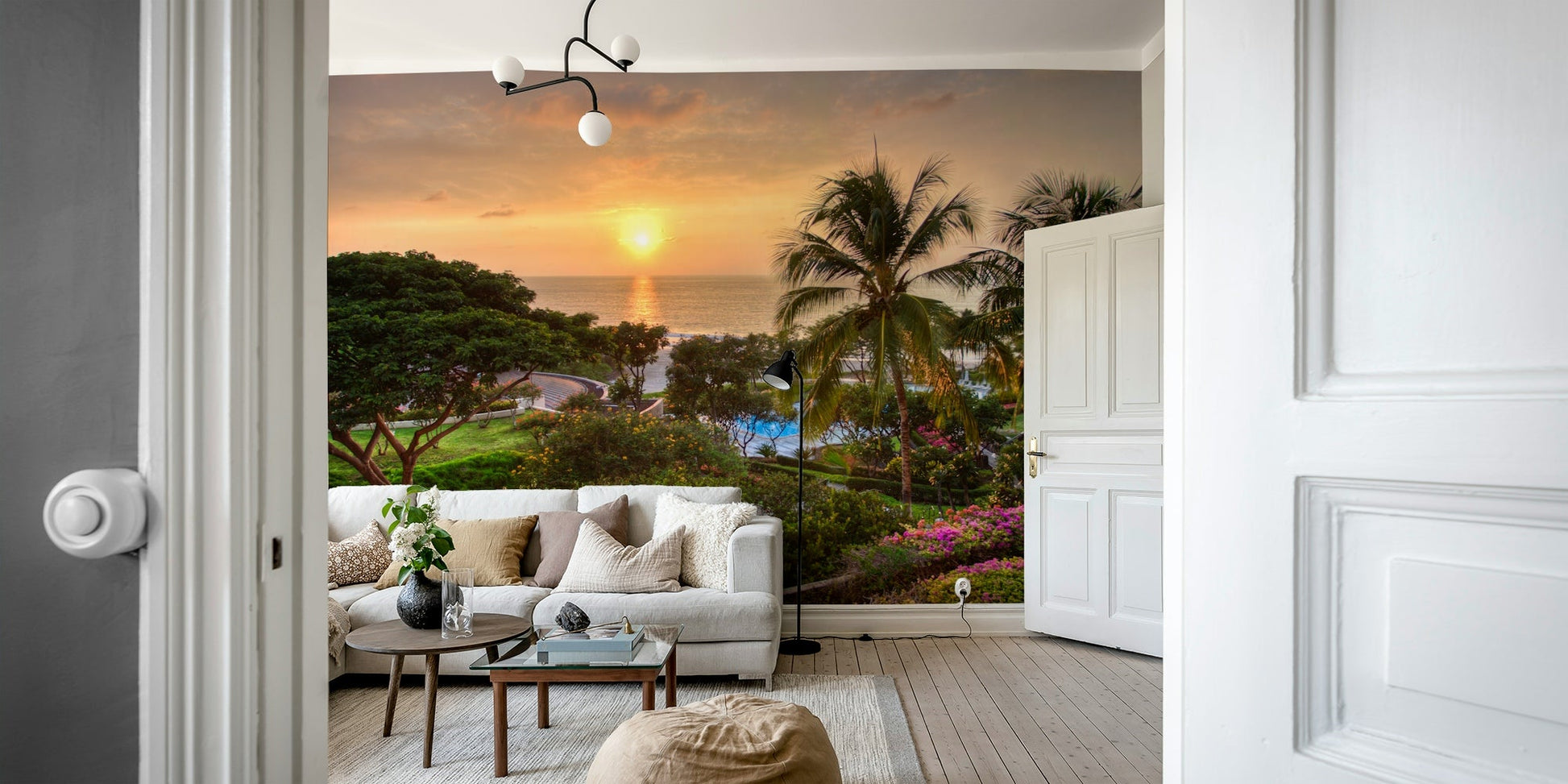 Tranquil Hawaii Island Sunset wallpaper mural with a tropical sunset behind a white sofa and leather pouf