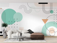 Geometric Shapes wallpaper mural styled as a feature wall behind a dining table and chairs in white tones