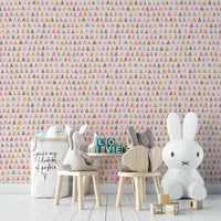 Hand-drawn triangle shapes in shades of pink on wallpaper.

