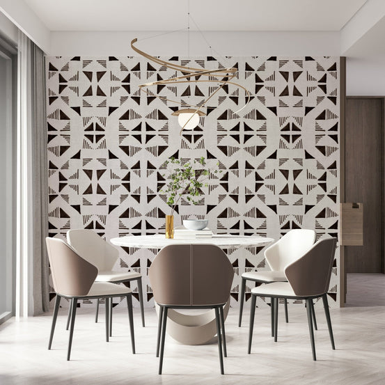 Triangles Composition Chocolat wallpaper in brown and cream behind a round dining table with taupe chairs