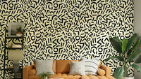 Retro art deco squiggles on cream background wallpaper
