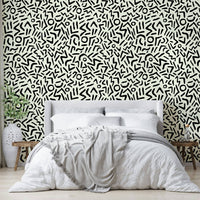 Black ink doodle wallpaper with geometric tribal shapes
