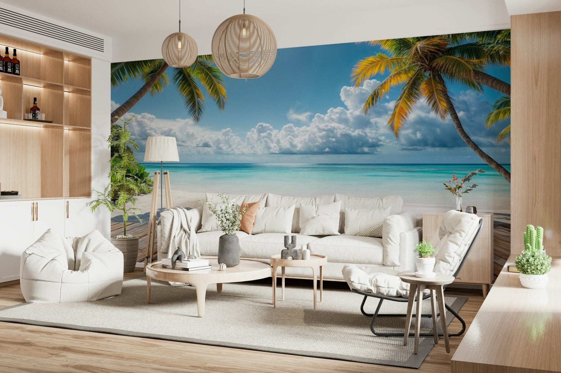 Tropical Beach View wallpaper mural of palms over a calm beach behind a large white sofa in an airy living room