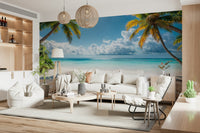 Tropical Beach View wallpaper mural of palms over a calm beach behind a large white sofa in an airy living room