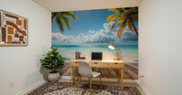 Tropical Beach View wallpaper mural showing turquoise sea behind a wood desk and laptop in a home office