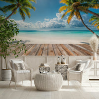Tropical Beach View wallpaper mural of palms over a beach behind white wicker chairs on a bright outdoor patio